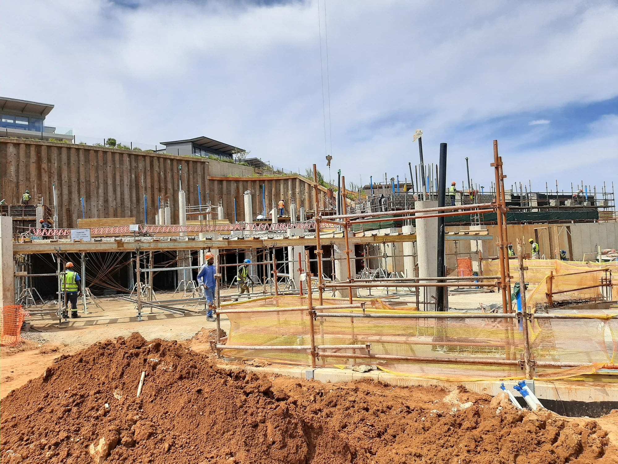 Concrete construction with formwork, temporary supports and site activity